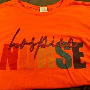 2 Hospice books and a Hospice Nurse TShirt.